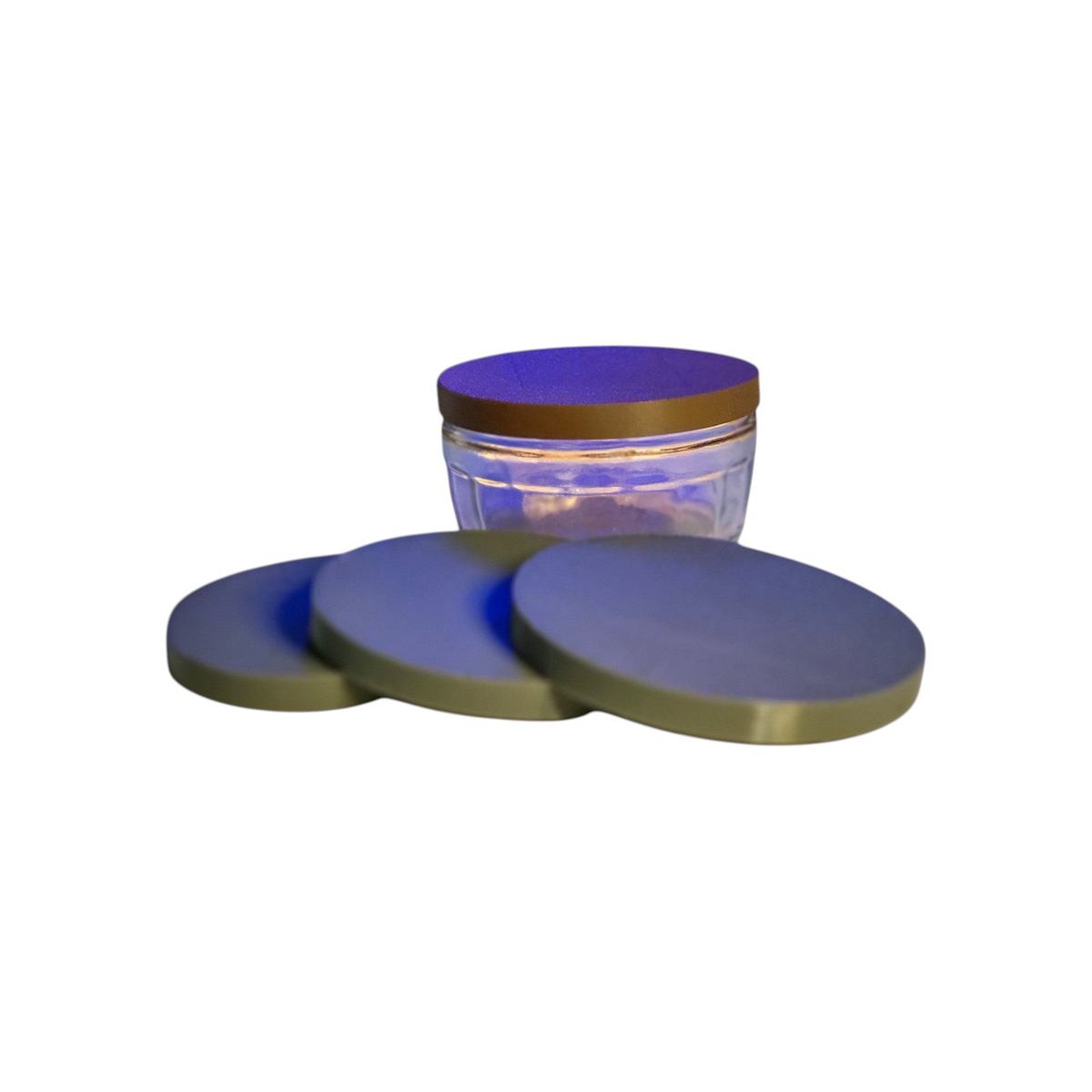 ARt flexible 82mm lids for GU ramekin jars in matte grey, shown stacked and fitted on a glass pot