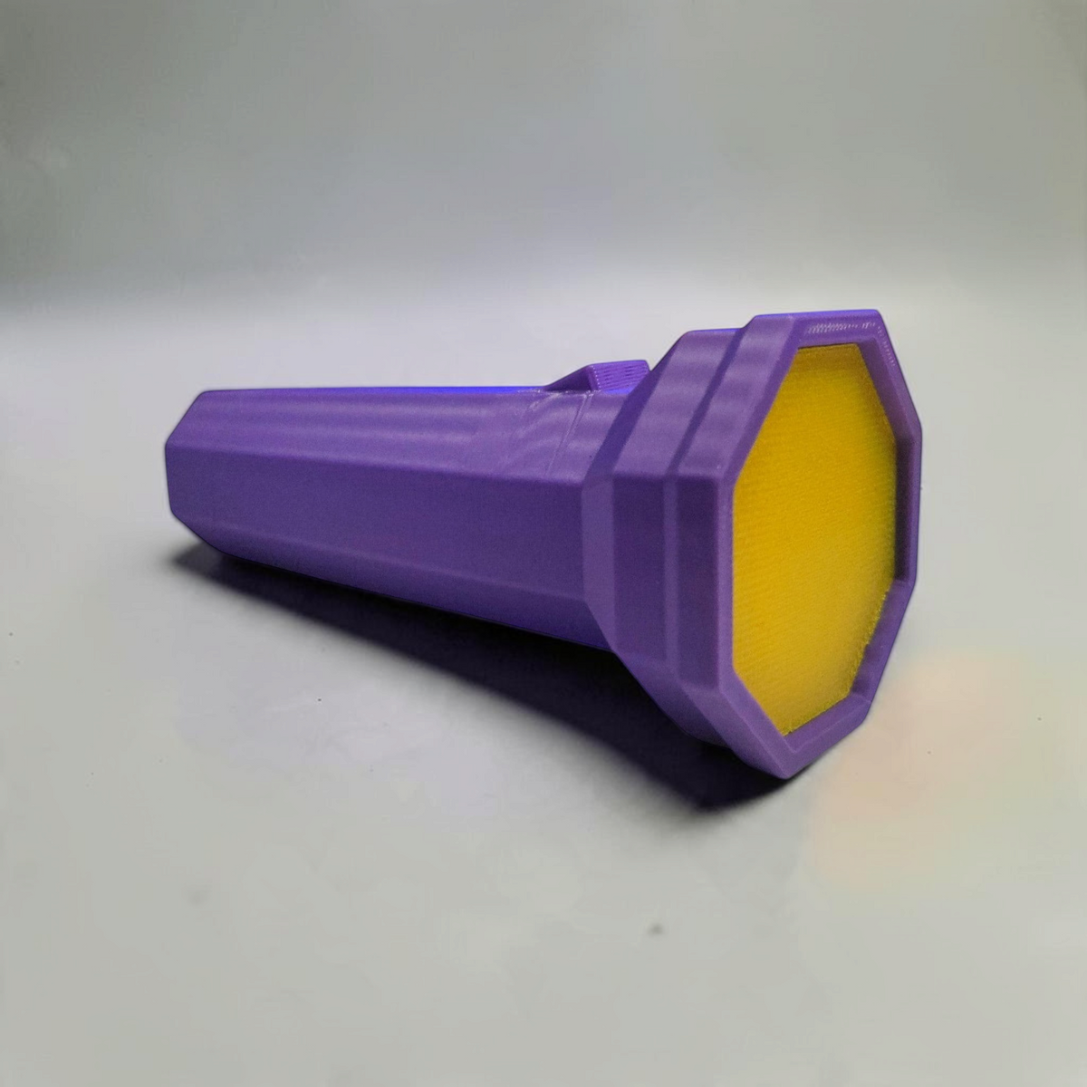 Gray 3D printed flashlight replica inspired by Doors, shown from the side.