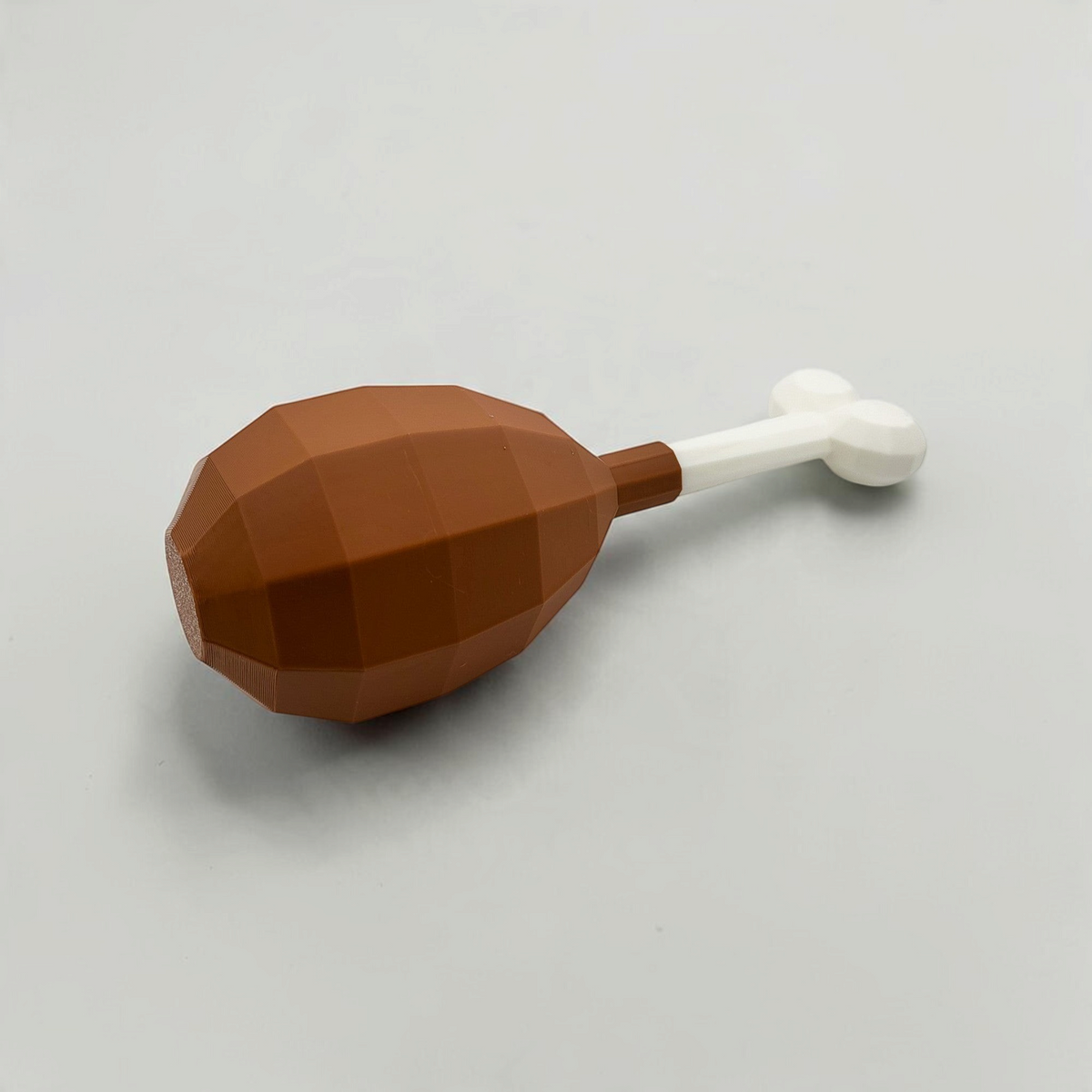 Brown turkey leg cosmetic fan art with a white bone on a white background