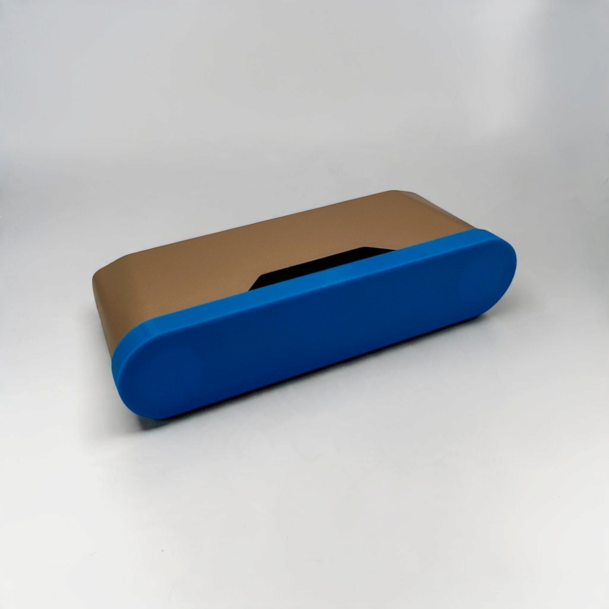Gold and blue protective cover fitted over a handheld 3D scanner.