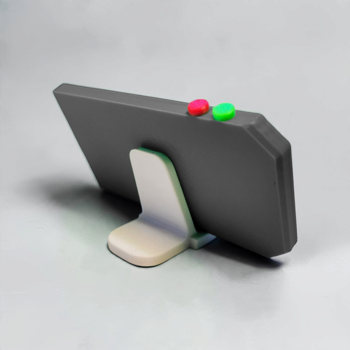 Rear of the gray NVCS 3000 prop showing its white support stand and red and green buttons along the top.
