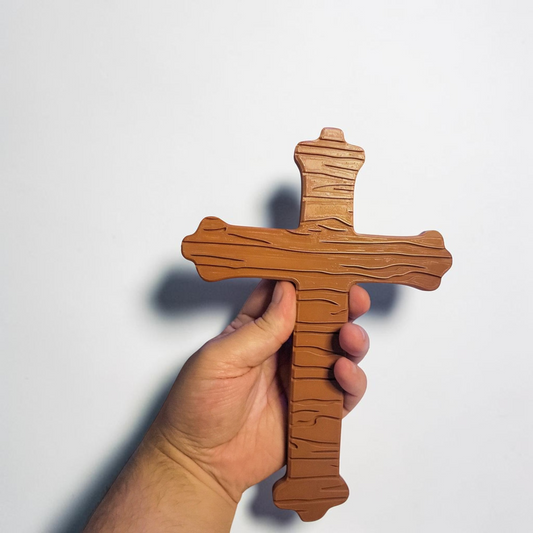 ARt brown 3D printed crucifix prop inspired by the game Doors, held in a hand against a white background.